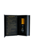 Cargar la imagen en la vista de la galería, Black essential oil bottle with gold cap in an open black box on a white background