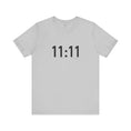 Charger l'image dans la visionneuse de la galerie, White t-shirt with '11:11' print on a white background