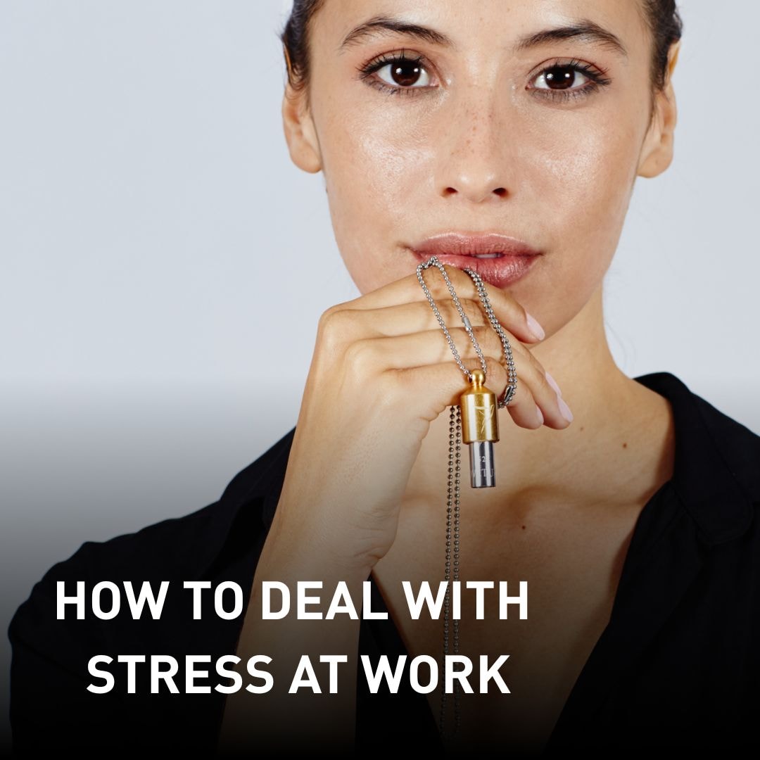Woman holding a Lovetuner to her lips, looking directly into the camera. Text overlay: 'How to Deal with Stress at Work