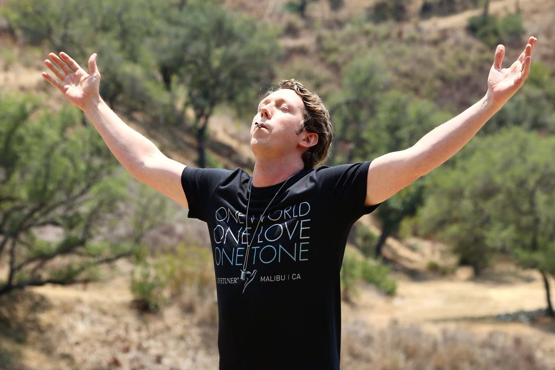 Man on nature using Lovetuner breathing tool