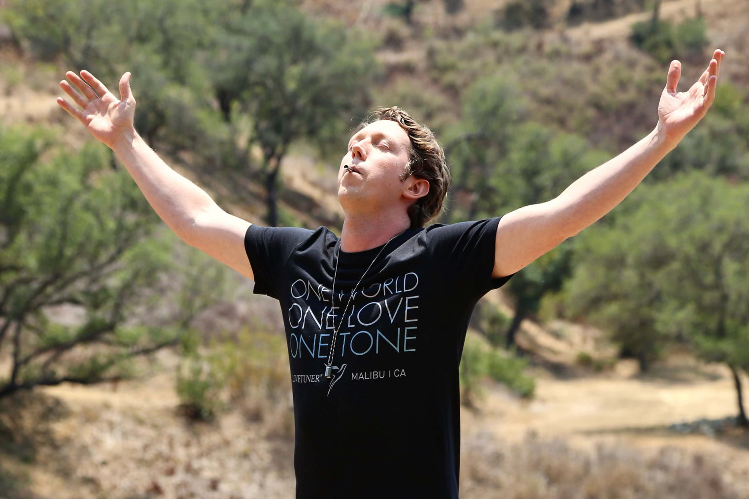 Man on nature using Lovetuner breathing tool