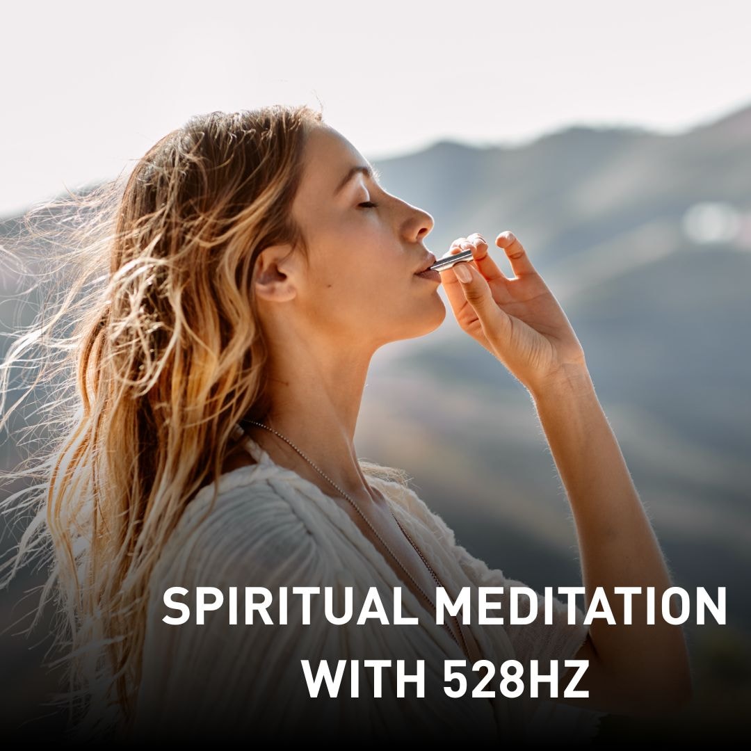 Young woman meditating outdoors with eyes closed, holding a tuning fork near her lips – promoting spiritual meditation with 528Hz healing frequency.