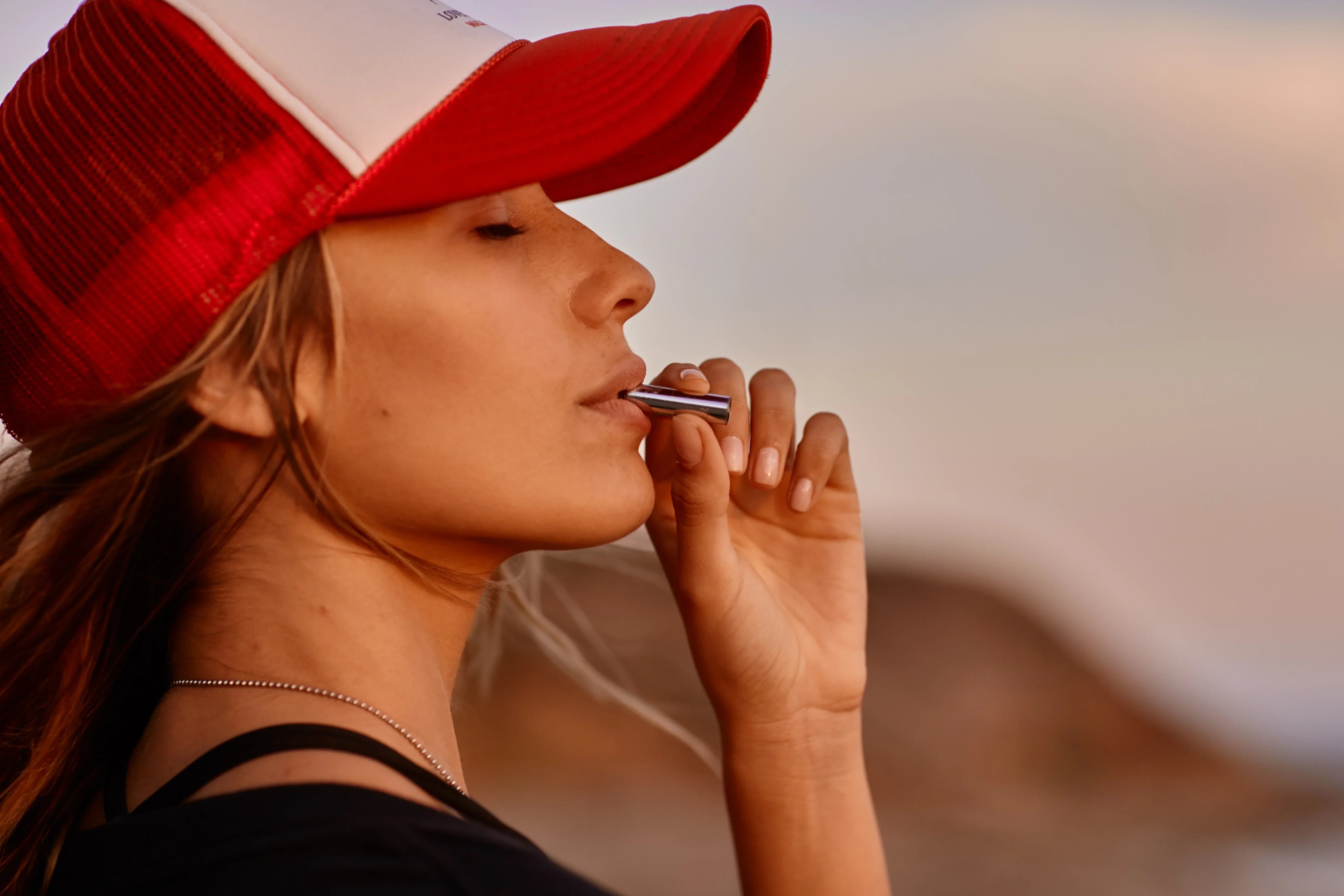Woman using frequency therapy tool