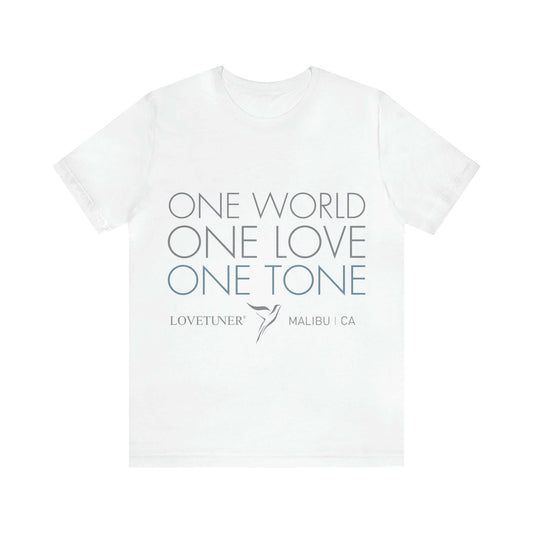 Lovetuner unisex white T-shirt featuring 'One Love One World One Tone' design, resonates with 528 Hz miracle tones for harmony and balance.