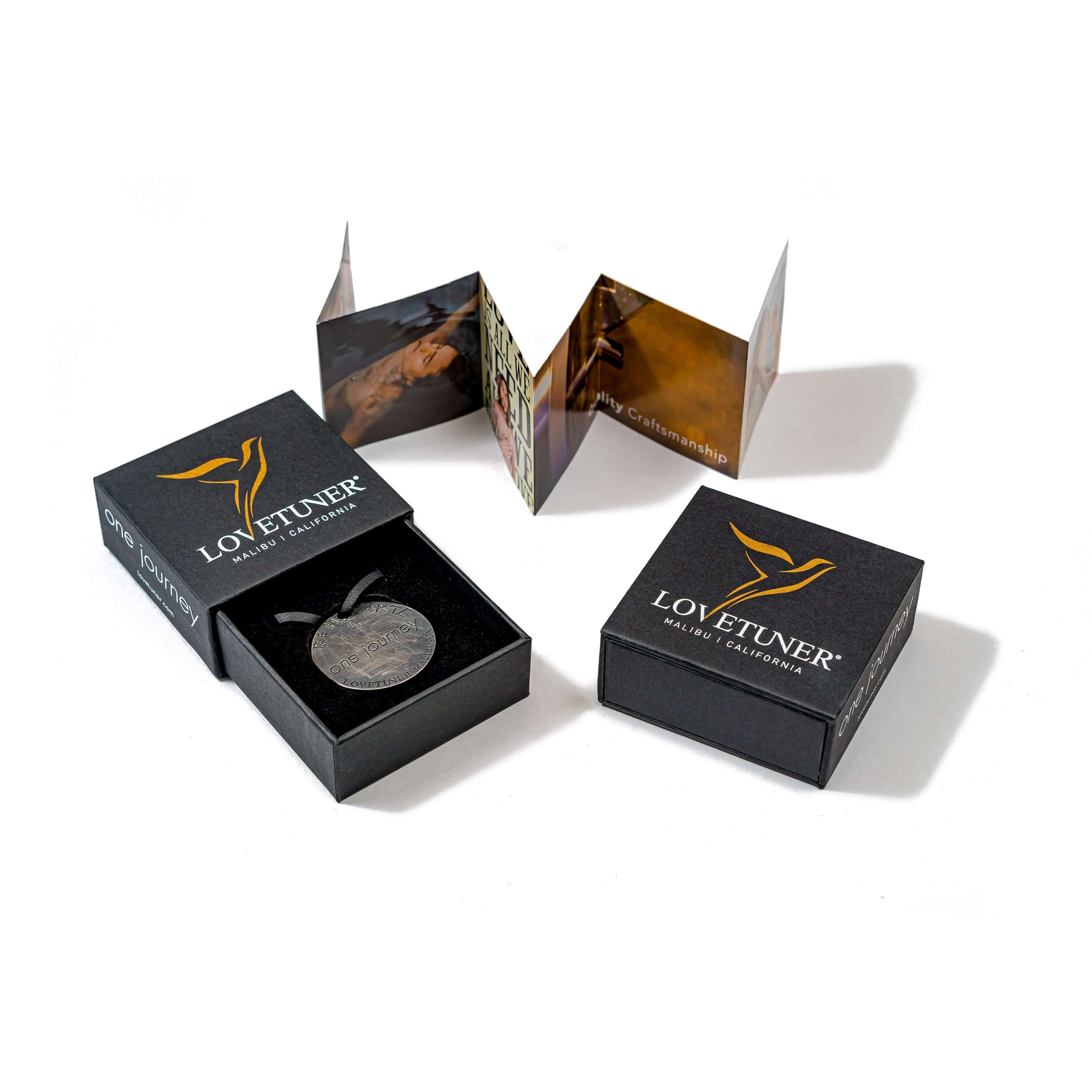 Lovetuner Amulet mental health necklace promoting mindfulness, stress relief, and emotional balance through healing frequency.