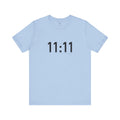 Light blue t-shirt with '11:11' print on a white background