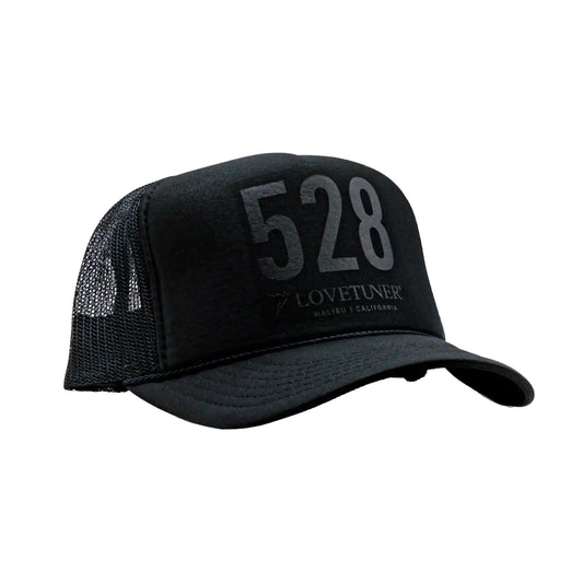 Black trucker cap with '528' and brand name on a white background