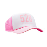 Pink and white cap with '528' printed on a white background