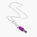 Purple and silver cylindrical Lovetuner whistle on a chain against a white background