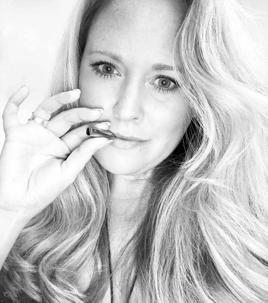 A black and white photo of a woman using the Lovetuner